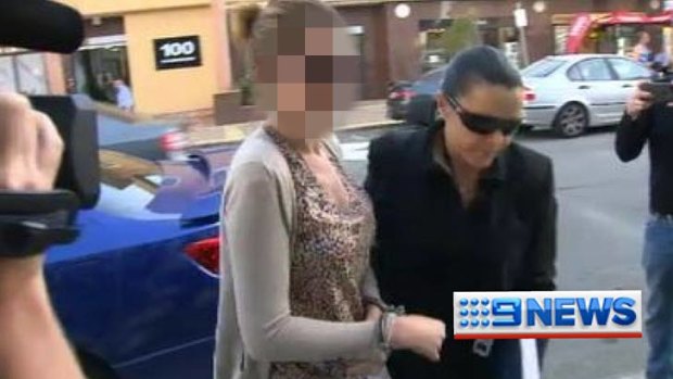 Police take Melissa Shaw into custody for questioning over the death of Shyam ‘‘Sam’’ Dhody.