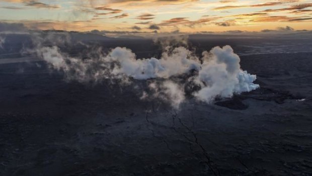 Steam and smoke rise over a 1km-long fissure in a lava field north of the Vatnajokull glacier, which covers part of the Bardarbunga volcano system.