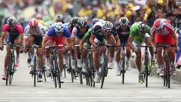 Leader of the pack: German Marcel Kittel (black and white) leads home the sprinters, including Australia's Mark Renshaw, to win the forth stage of the Tour de France.