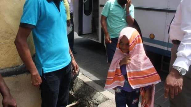 A young asylum seeker turns up at court in Galle, Sri Lanka, after being transferred by Australia to the Sri Lankan navy.