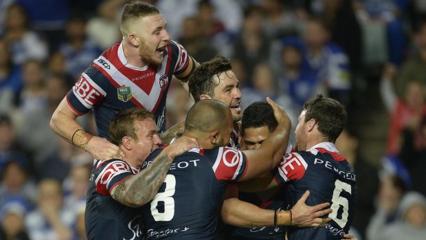 Ruling the Roosters: Roger Tuivasa-Sheck celebrates scoring a try with teammates.