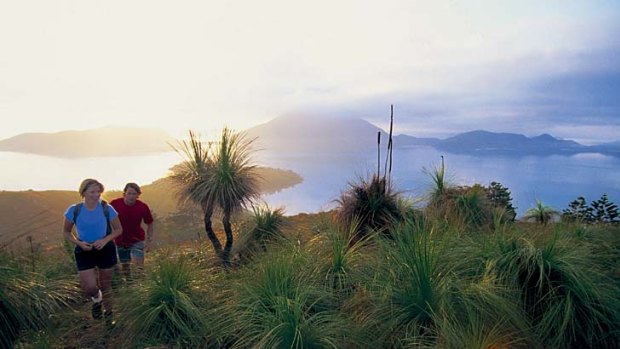 Hikers take the high trail on Lindeman Island.