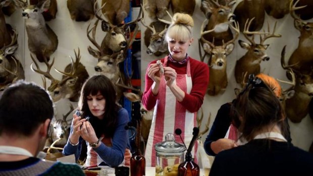 Natalie Delaney-John (standing) teaches one of her taxidermy classes.