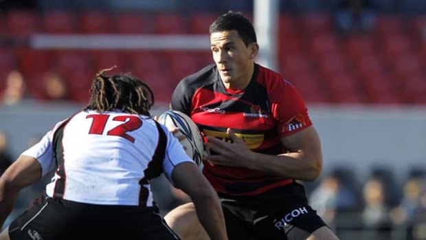Sonny Bill Williams of Canterbury is tackled by Tana Umaga of Counties Manukau in the ITM cup.