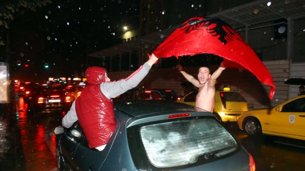 Celebration: Albanian fans celebrate after the national side qualified its first ever European Championships.
