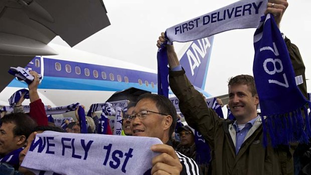 Boeing employees celebrate during Boeing's 787 Dreamliner ceremonial first delivery.