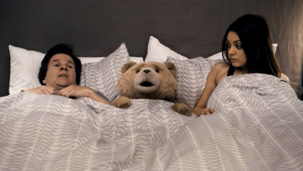 Mark Wahlberg, Ted (voiced by Seth MacFarlane) and Mila Kunis in a scene from Ted.