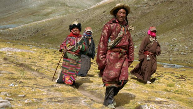 Tibetan Buddhist pilgrims on the kora, walking around Mount Kailas in Tibet.
