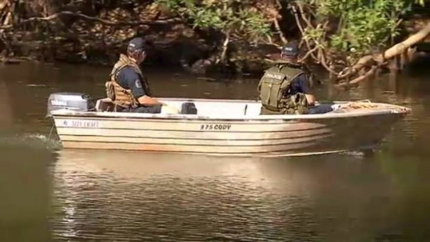 Police search a billabong in Kakadu National Park after a man was taken by a crocodile.