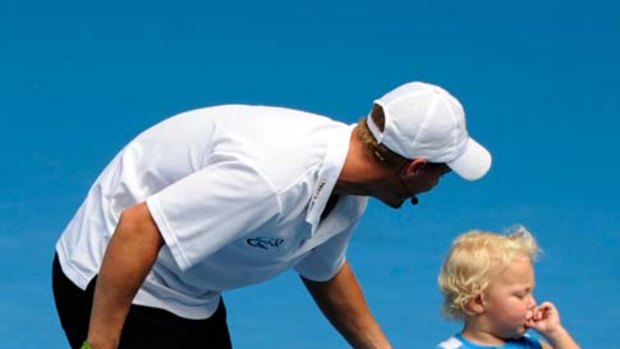 See that net ... Lleyton Hewitt with his son Cruz at the flood relief fund-raiser yesterday.