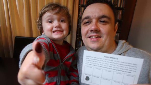 Paul Clifford with son, Noah, 3, using the Find Me Safe kit.