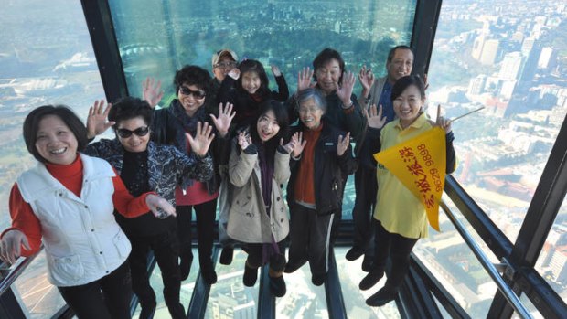 Southern star ... Chinese tourists on the Eureka Skydeck in Melbourne.