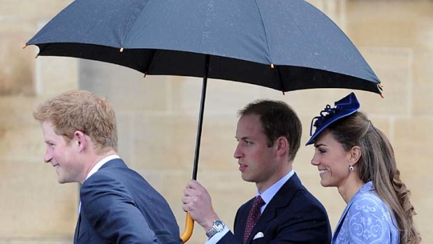 Family affair ... Britain's Prince Harry, left, along with the Duke and the Duchess of Cambridge, arrive.