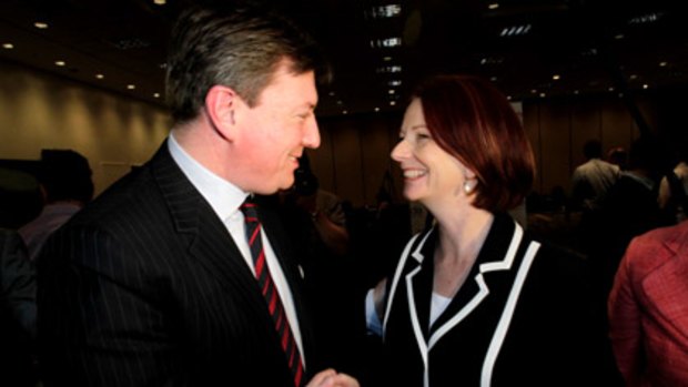 Former NSW opposition leader John Brogden and Prime Minister Julia Gillard in Brisbane today.