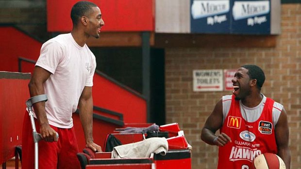 Reunited &#8230; injured guard Lance Hurdle and the Hawks' new signing Malcolm Grant.