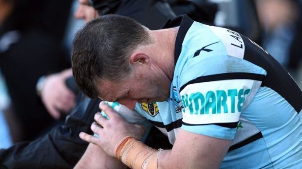 In arm's way: Paul Gallen clutches his injured biceps. The Sharks skipper was set to have scans on Sunday night.