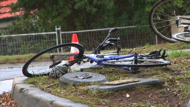 A bicycle lies abandonded near the site a woman was killed after a collision with a car on Mona Vale Road.