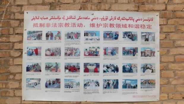 A poster at a village mosque sets out religious practices forbidden by the authorities.