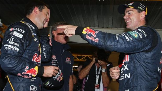 Jamie Whincup talks to teammate Craig Lowndes after winning race five of the Tasmania 400.