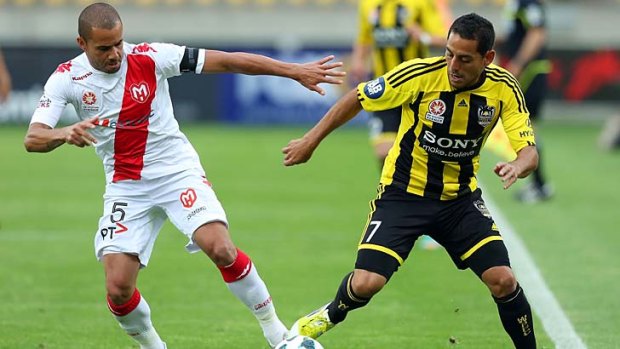 Duel &#8230; Phoenix's Leo Bertos and Fred, of Melbourne Heart, do battle in Wellington on Thursday.