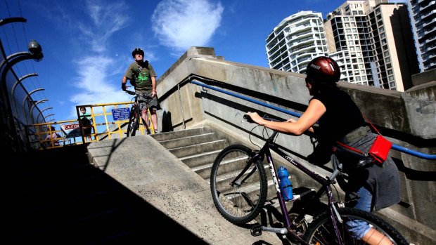 Cyclists on the steps leading up to the Harbour Bridge. 