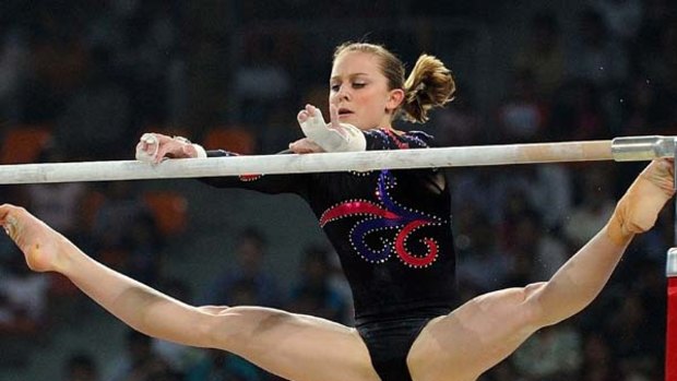 Lauren Mitchell of Australia won her third gold medal at the Delhi Games on the uneven bars.