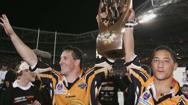 The good times: Benji Marshall and Mark O'Neill celebrate winning the 2005 NRL Grand Final.