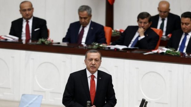 Turkey's President Tayyip Erdogan says the country will fight against Islamic State and other "terrorist" groups in the region but will stick to its aim of seeing Syrian President Bashar al-Assad removed from power.