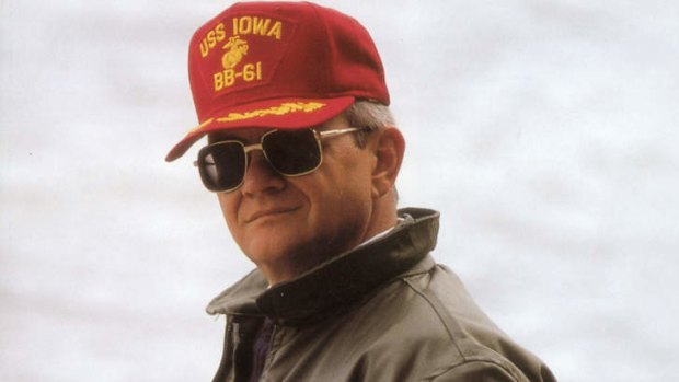Author Tom Clancy wearing cap which reads on it USS Iowa BB-61, pictured in 2000.
