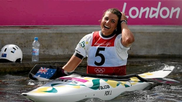 Australia's Jessica Fox celebrates her K1 canoe slalom silver medal on the course at the Lee Valley White Water Centre.