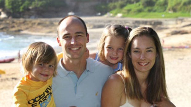 Near miss ... Brent Thomas with his wife Tessa and children Bella, 6, and Harry, 3, at Cronulla Beach.