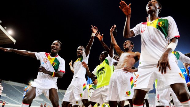 Guinea players celebrates their qualification for the  2015 African Cup of Nations.