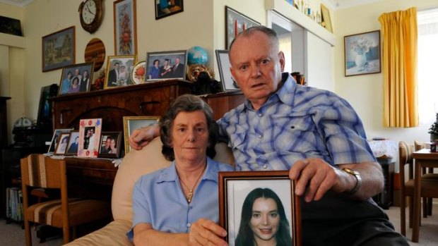 Susan and Kevin O'Keefe with a picture of their daughter Jeanette, 28, who was found murdered in Paris 11 years ago. A man is on trial for the crime.