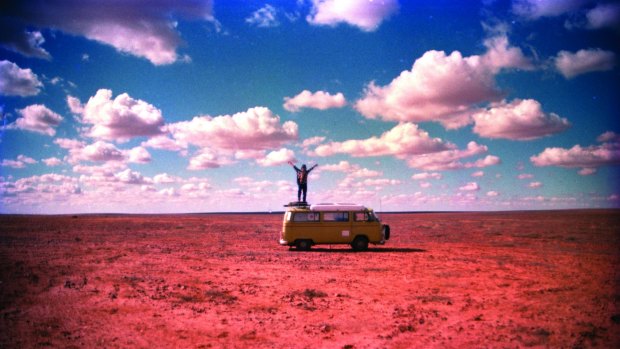 Yeldham on top of his Kombi in Sturt National Park, NSW in 1996.