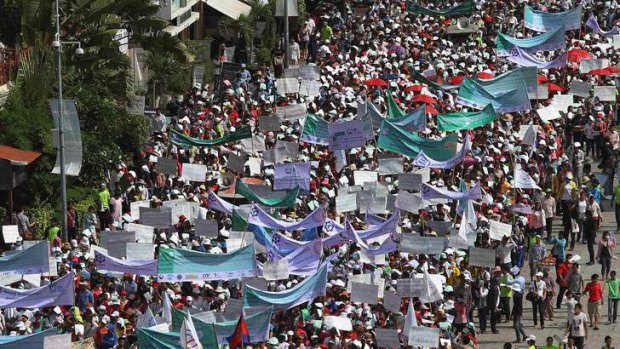 Calls for action on industrial safety: garment workers march on May Day in Phnom Penh.