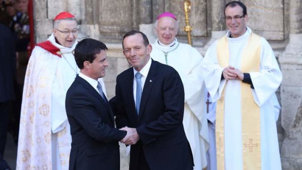 Prime Minister Tony Abbott with French Prime Minister Manuel Valls at the Bayeux Cathedral for a D-Day service in France.