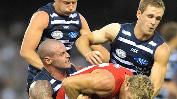 Costly: Cat Josh Hunt copped a two-game ban for this sling tackle on Swan Luke Parker.