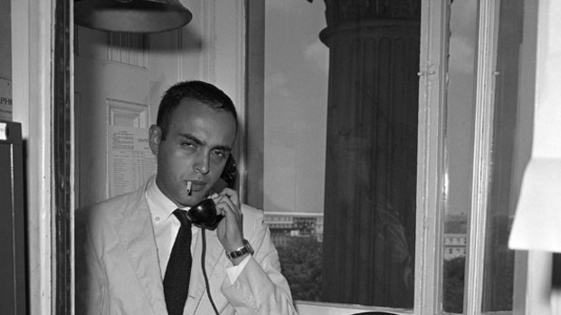 In this August 15, 1958 black-and-white file photo, Associated Press staff reporter Robert Novak is shown at work as he talks on the telephone in the Senate Press Gallery on Capitol Hill in Washington.