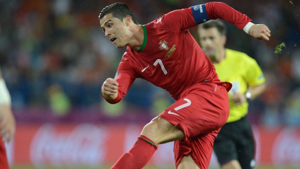 Cristiano Ronaldo blasts home the winner for Portugal over the Netherlands in Kharkiv.