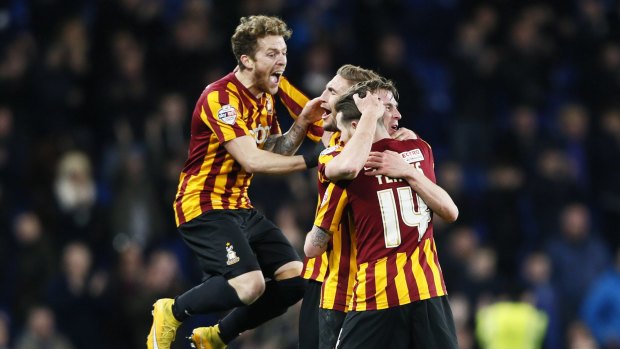 Bradford City players celebrate winning against Chelsea after their FA Cup fourth-round match at Stamford Bridge in London on Saturday.
