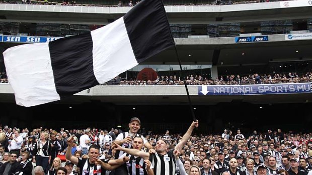 Magpies fans enjoy the atmosphere before the 2010 grand final.