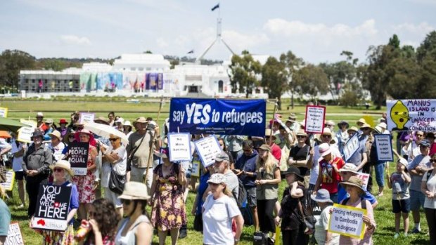 SUNDAY RALLY: Supporters of refugees' rights march to Parliament House.