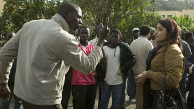 Boiling point...an immigrant argues with a resident in the Southern town of Rosarno.