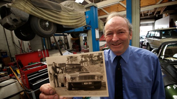 Peter Robinson sold an Asto Marten to Prince Charles . Seen here in his South Melbourne workshop witha photo of himself from the day.