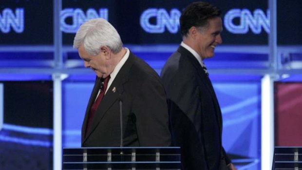 War path ... former Speaker of the House Newt Gingrich (left) and former Massachusetts Governor Mitt Romney.