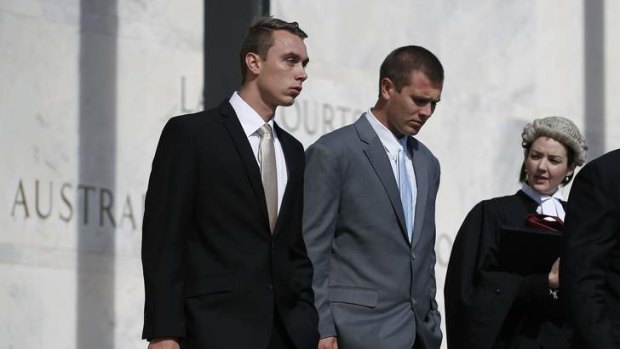 Former ADFA cadets Dylan Deblaquiere, left, and Daniel McDonald, centre, leave the ACT Supreme Court after appearing in relation to the ADFA skype scandal.