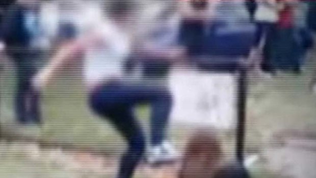 A still from footage of the 14-year-old being attacked.