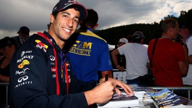 Daniel Ricciardo signs autographs ahead of the Austrian Formula One Grand Prix.