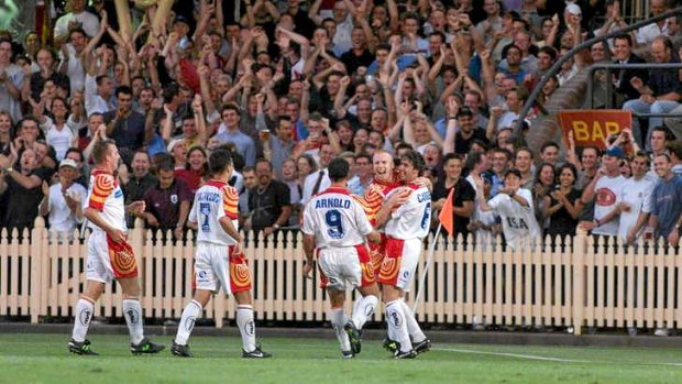 Northern exposure: Robbie Slater celebrates a goal in front of a healthy North Sydney Oval crowd in 1999.