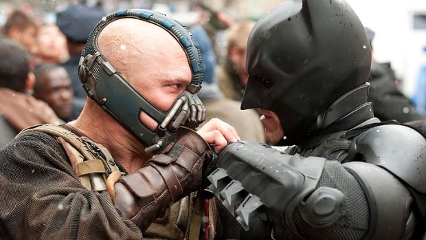 Bane (Tom Hardy) and Batman (Christian Bale) do battle in <i>The Dark Knight Rises</i>.